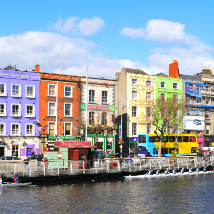 A row of colourful flats above shops in Dublin